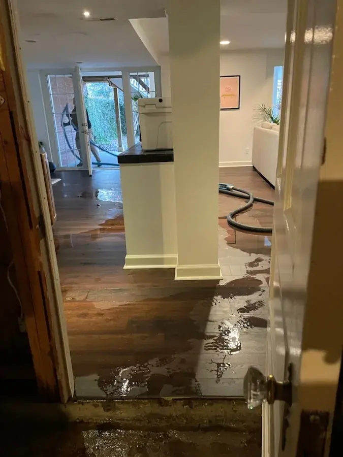 Standing flood water pooled across a floor in a North Dallas home